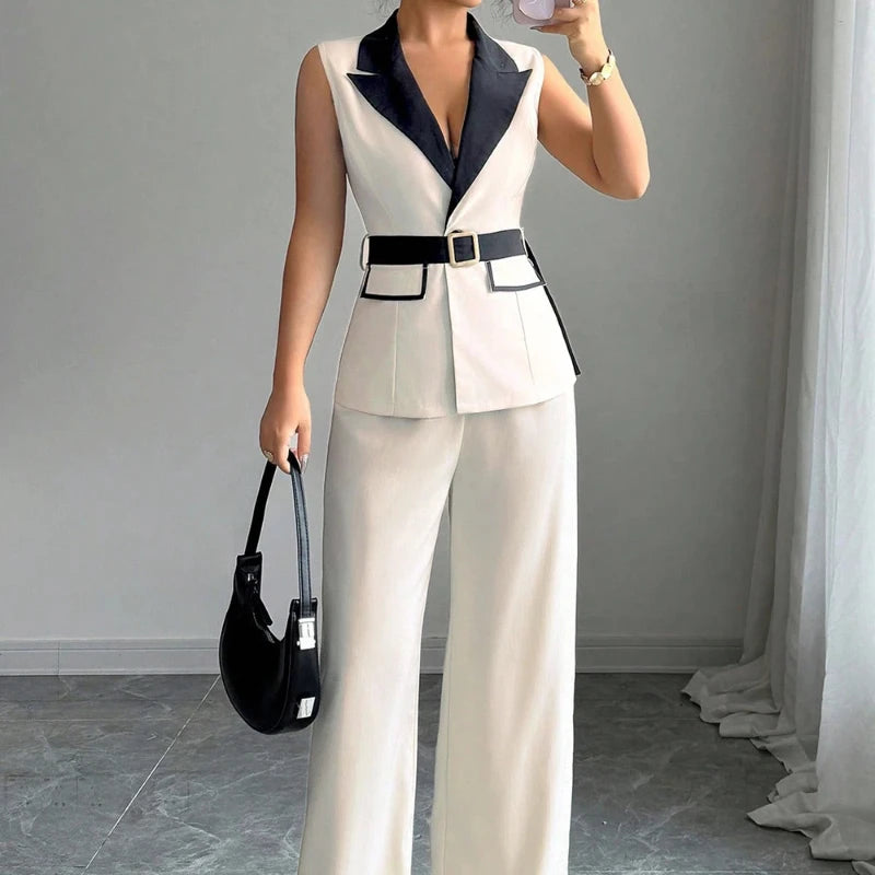 Fashion women's clothing with elegant style, V-neck, waist-revealing, sleeveless top, straight-leg pants. 2-piece set jacket set