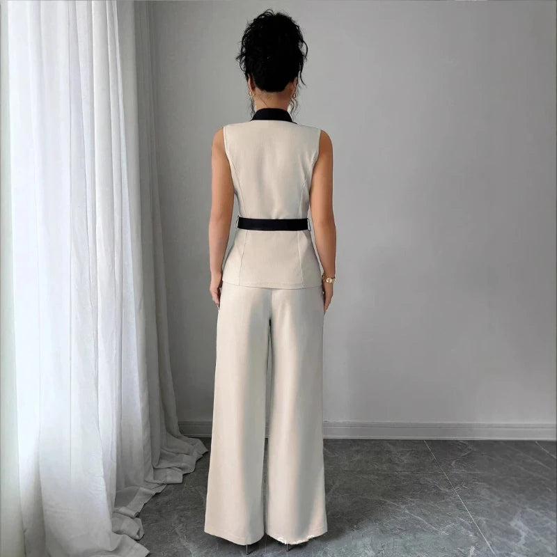 Fashion women's clothing with elegant style, V-neck, waist-revealing, sleeveless top, straight-leg pants. 2-piece set jacket set