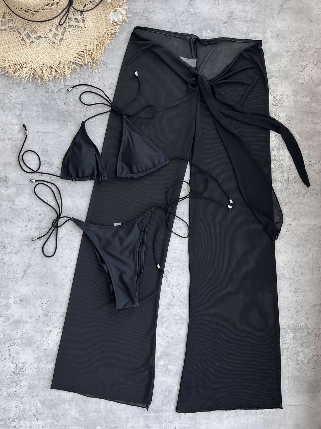 2025 Elegant Black Bikini Set with Transparent Bottoms Urban Style Beachwear White Wall Lightweight and Breathable Summer Beach
